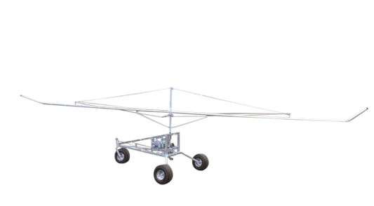 A 33 foot boom irrigator with a galvanized frame and wheels, designed for agricultural watering.